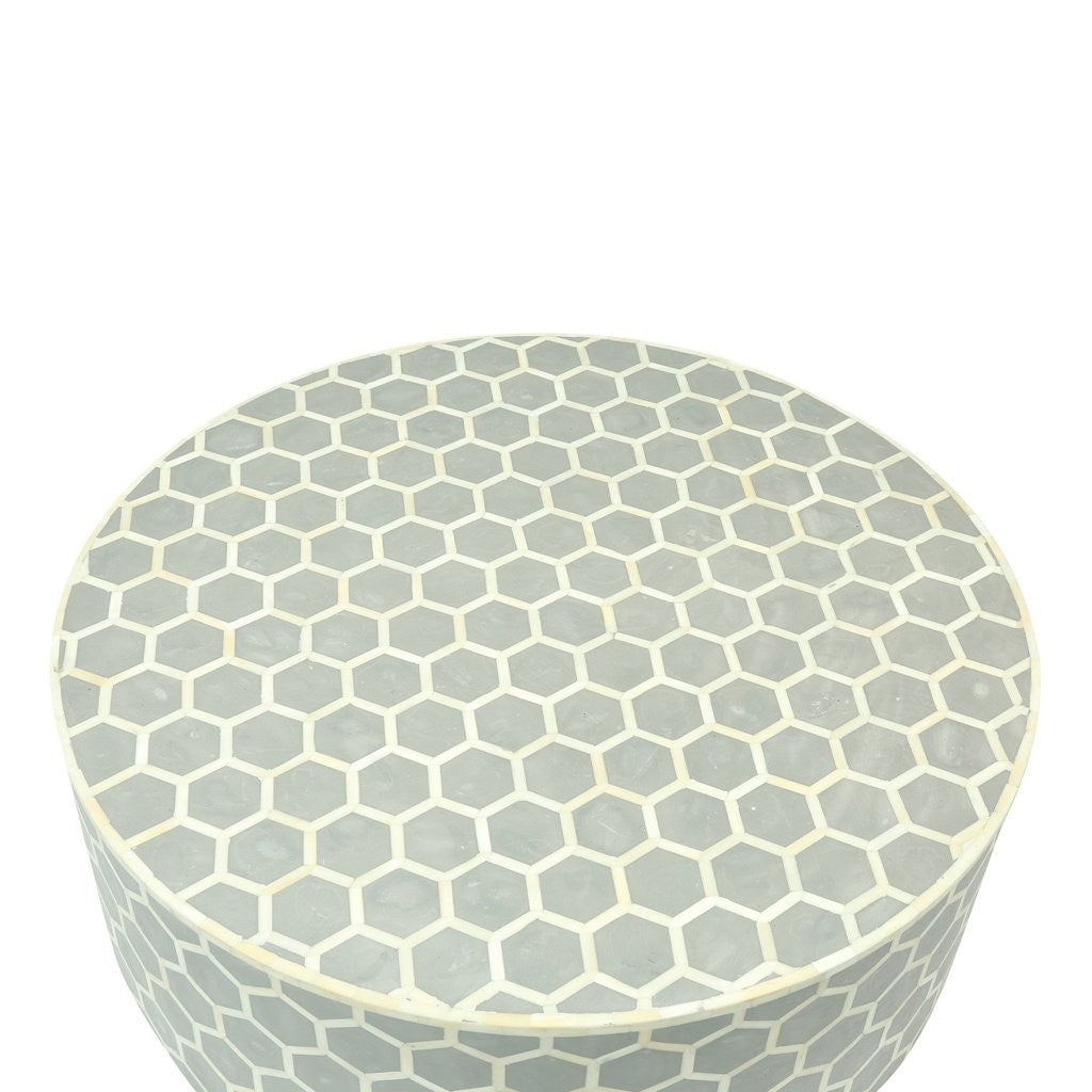 Mesa de centro redonda con diseño de panal y incrustaciones de hueso